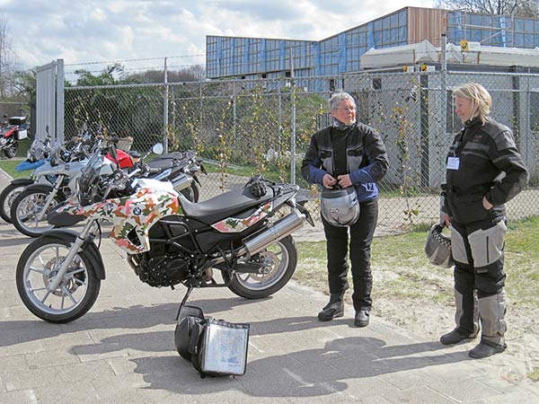 Two older women next to a BMW F650GS