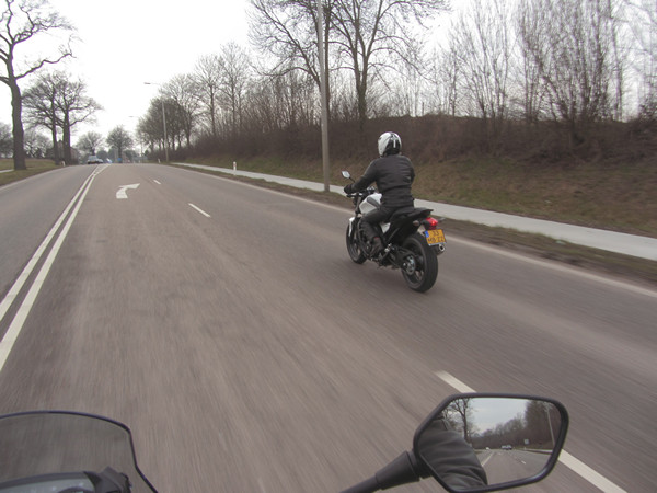 Motorcycle rider on white motorcycle