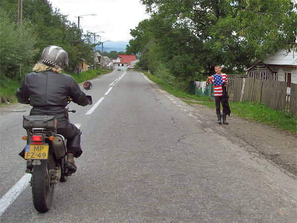 Boy gestures the wheelie sign