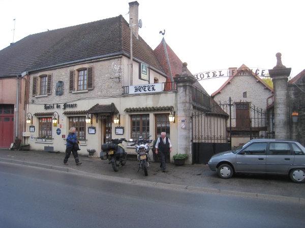 Hotel with motorcycles and old man