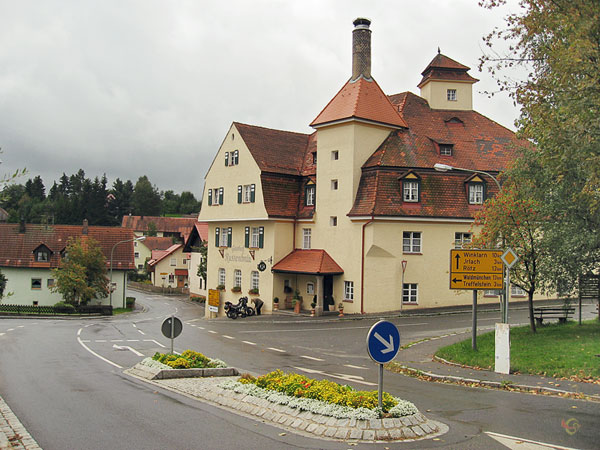 Building with red roof and a turret