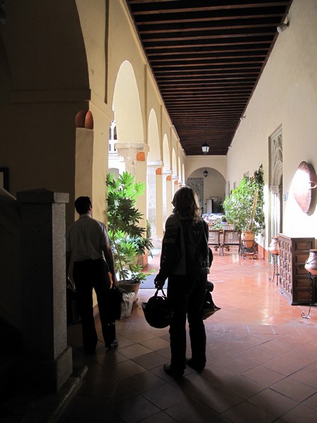 Sylvia with helmets in courtyard of a monastery