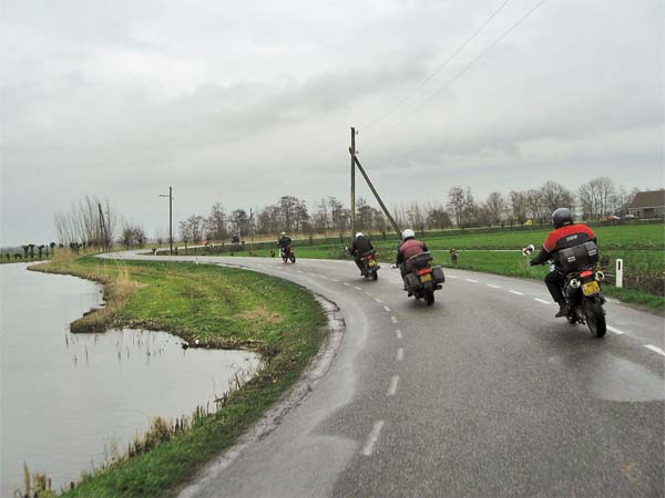 Motorcycle riders on a Dutch dike