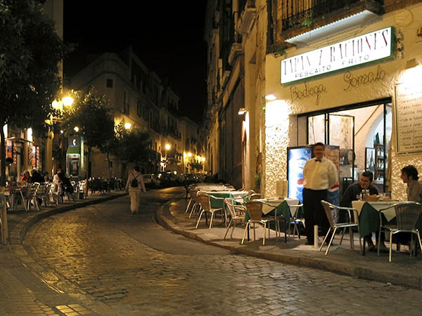 People eating outside, in the dark