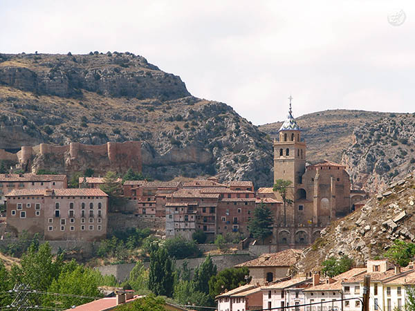 Houses and castle built on a mountain slope