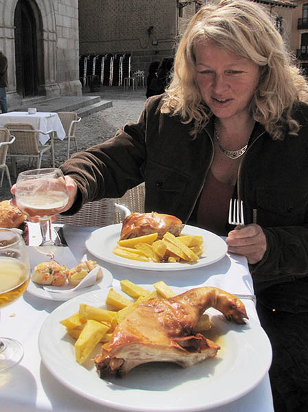 Sylvia with a pig suckling on her plate