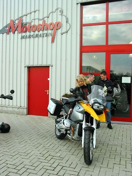 Brand new motorcycle in front of a motorcycle dealer