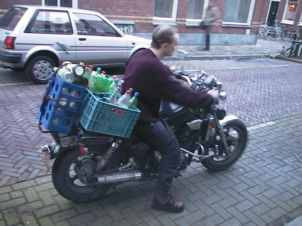 Motorbike loaded with bottles and crates