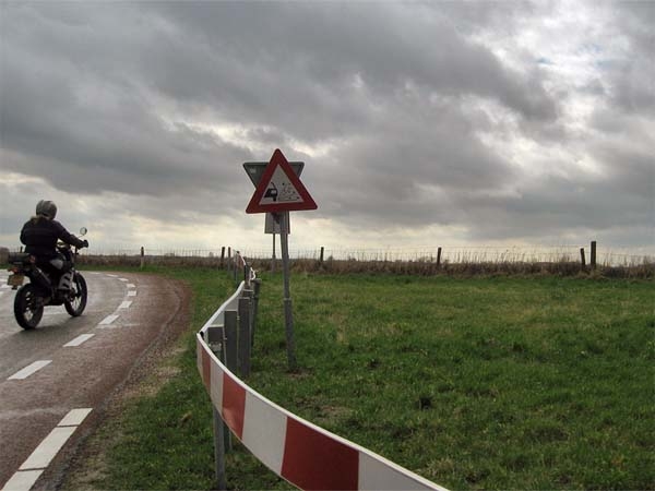 Tricker, and a warning sign for loose gravel