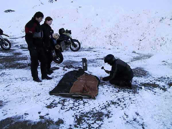 Hans in the snow trying to pitch a tent