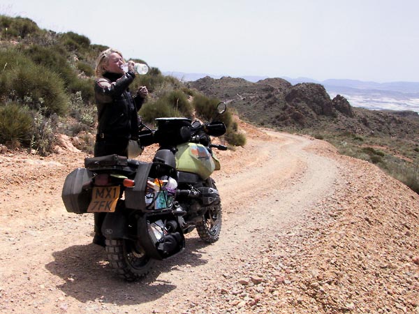 Case opened, drinking water, on unpaved road