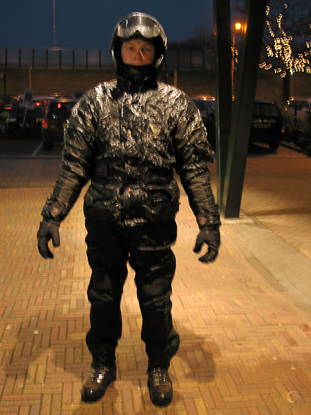 Motorcycle rider covered with ice