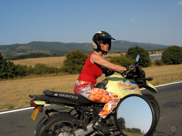 Helmet on, and riding with bare arms