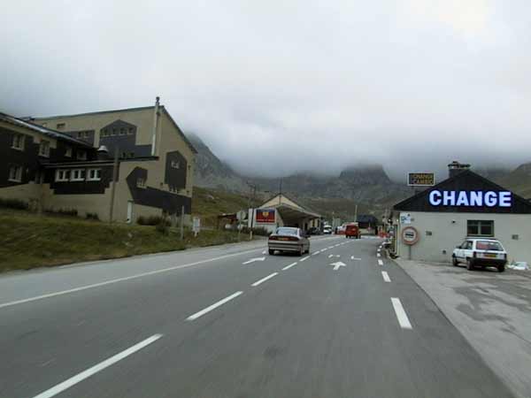 >A mountain road in the mist, a sign Change