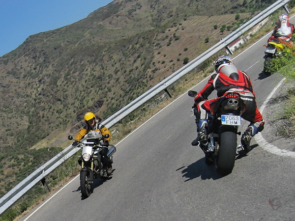 Three motorcycles, cornering