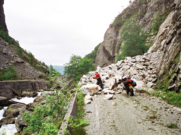 Sylvia pretending to throw away big rocks that block the road