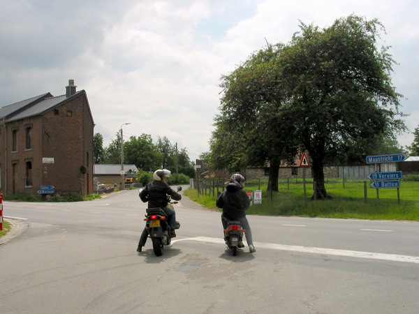 Motorcycle and scooter next to each other