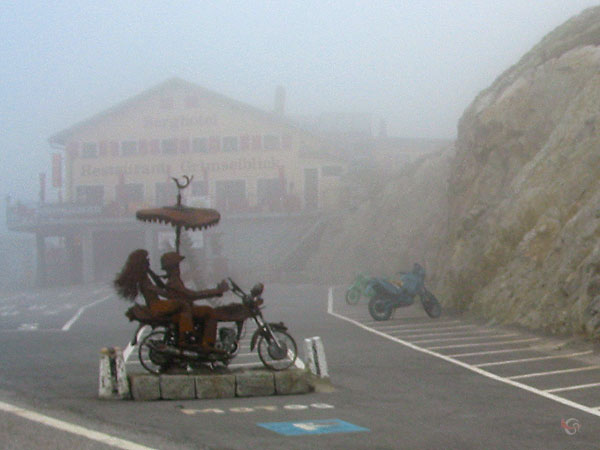 Metal statue of a motorcycle rider on the Grimsel pass