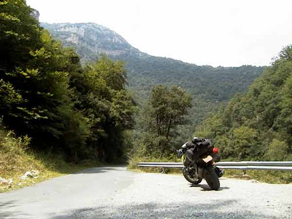 A motorcycle parked at the side of the road