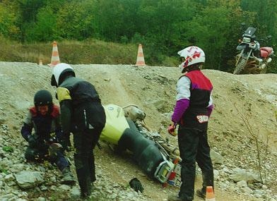 Motorcycle fallen alongside a hill