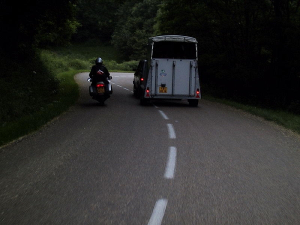 Motorcycle rider overtakes car