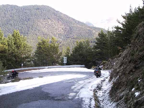 Honda Magna riding a switchback downward, in the snow