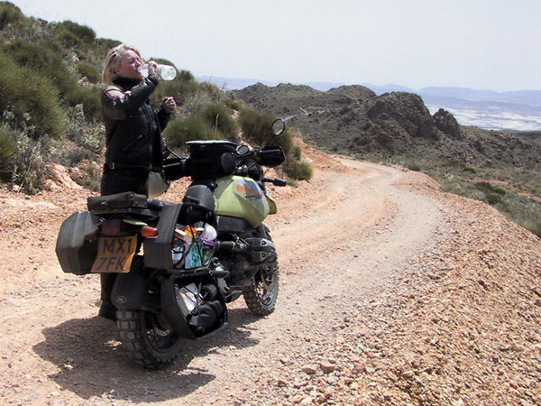 Sylvia, in a dry environment, next to a R1100GS, drinking water